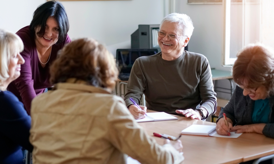 employees attending a group language training session in a meeting room